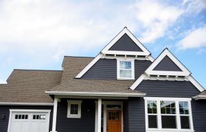 exterior of home with shingle roof