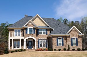 Large New Luxury Home against Blue Sky